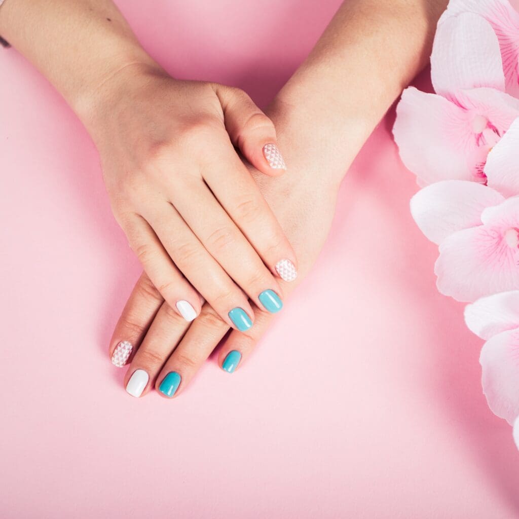 beautiful manicure. gel polish coating in white and turquoise, stamping.