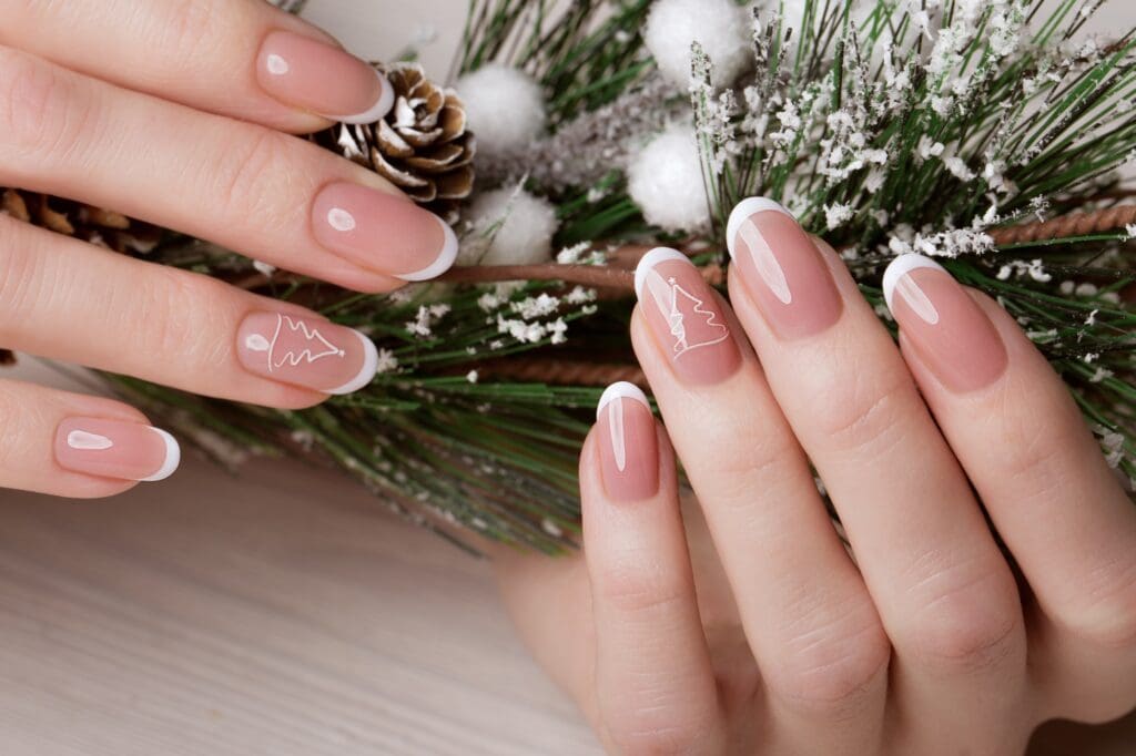 Snow White manicure on female hands. Winter nail design.